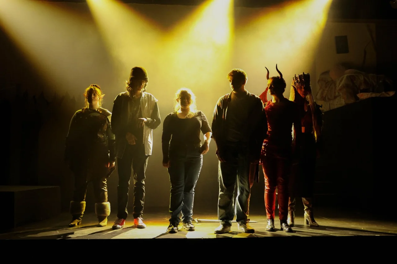 performers on stage in the black box theater for performing arts