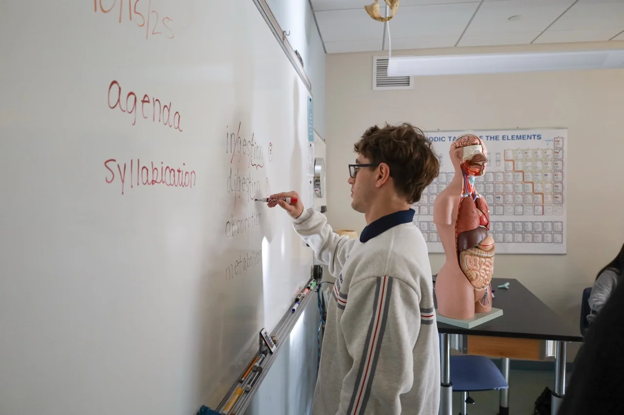student working on syllabication of science words to improve literacy