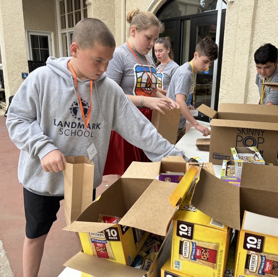 Students stuffing snack bags for Beverly Bootstraps