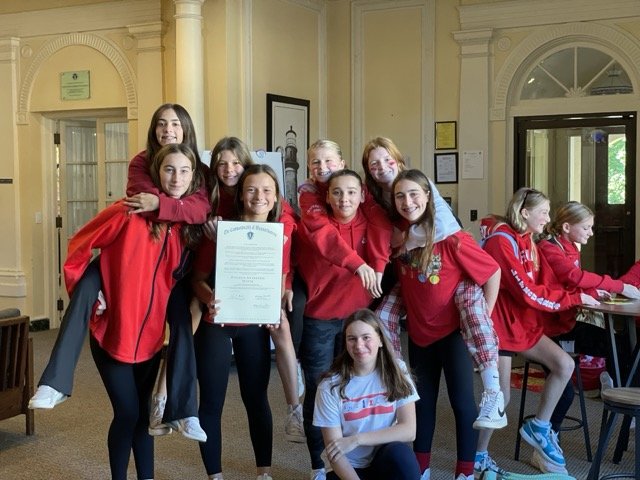 students wearing red for dyslexia awareness month