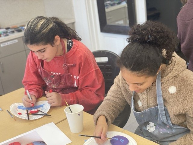 students painting dyslexia awareness rocks