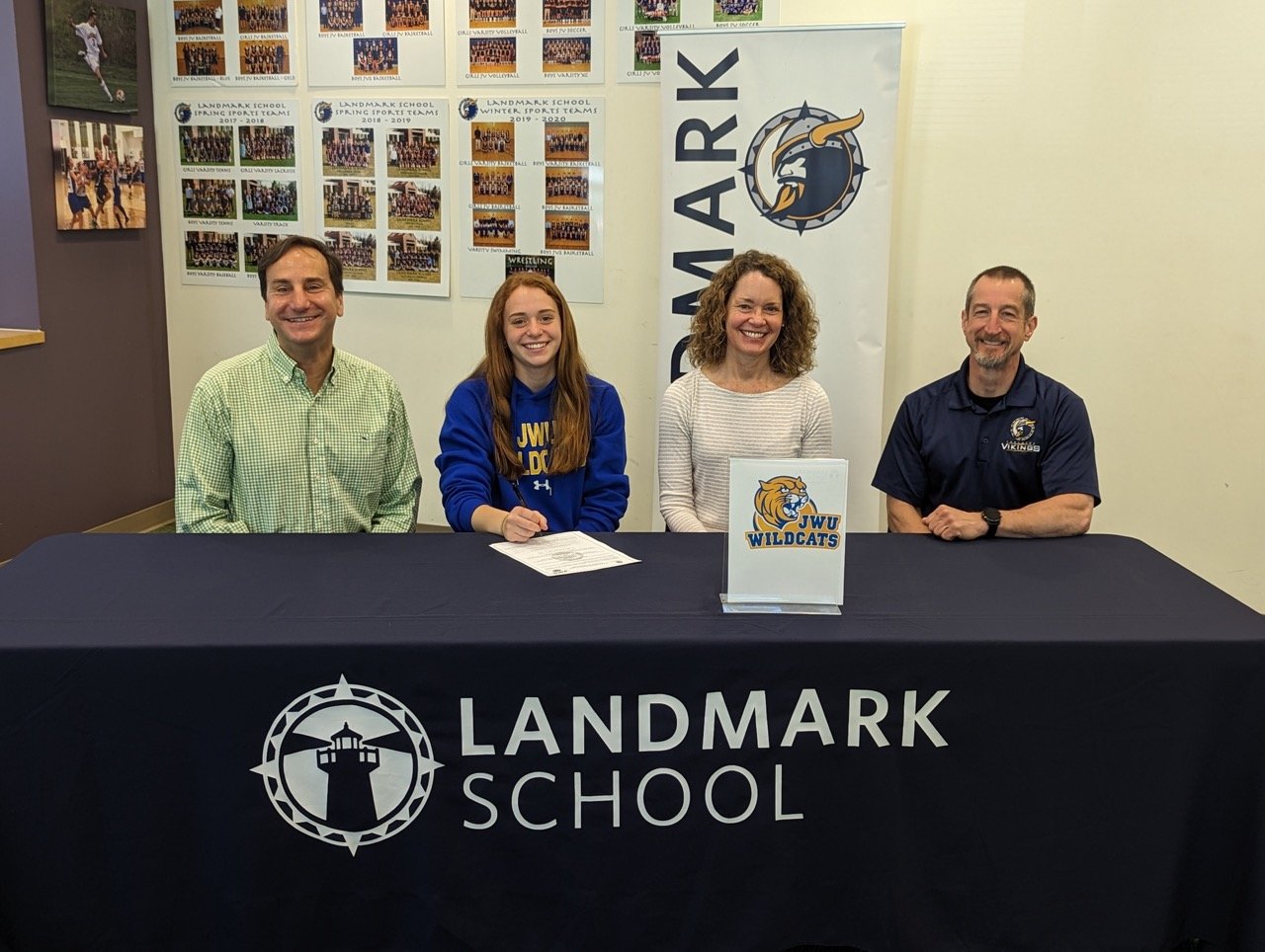 hannah with family at signing