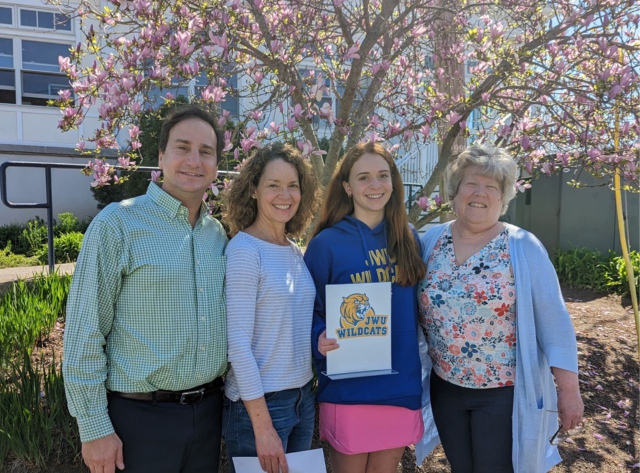 hannah with family and guidance counselor