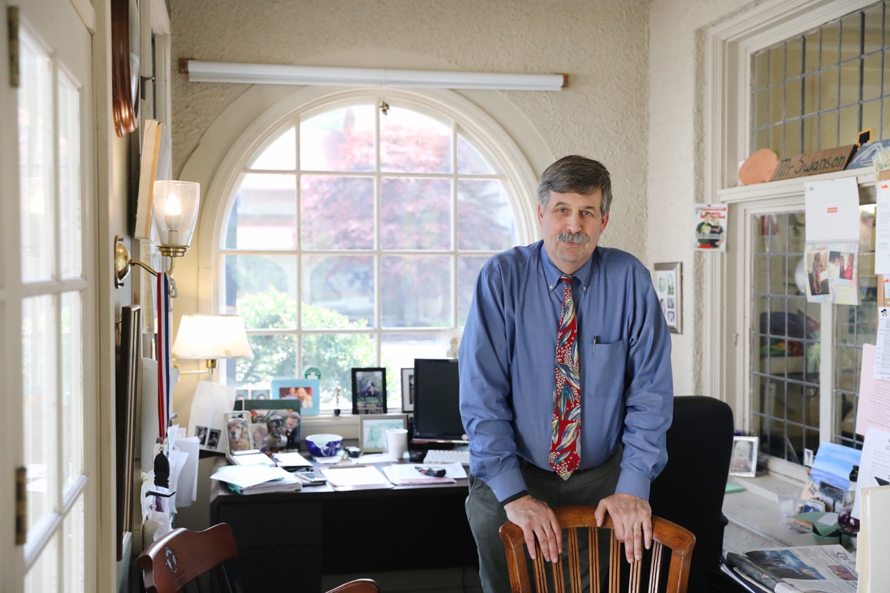 kirk swanson in his office